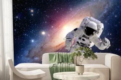 Fototapeta: Astronauta w kosmosie na tle galaktyki