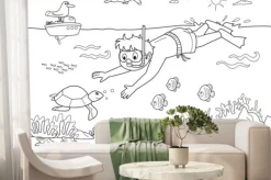 Fototapeta: Bambino che nuota sotto acqua con i pesci.