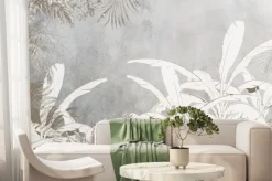 Fototapeta: Białe liście palmowe na szaro-beżowej ścianie