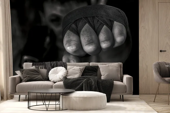 Fototapeta: Bokser mężczyzna uderza pięścią