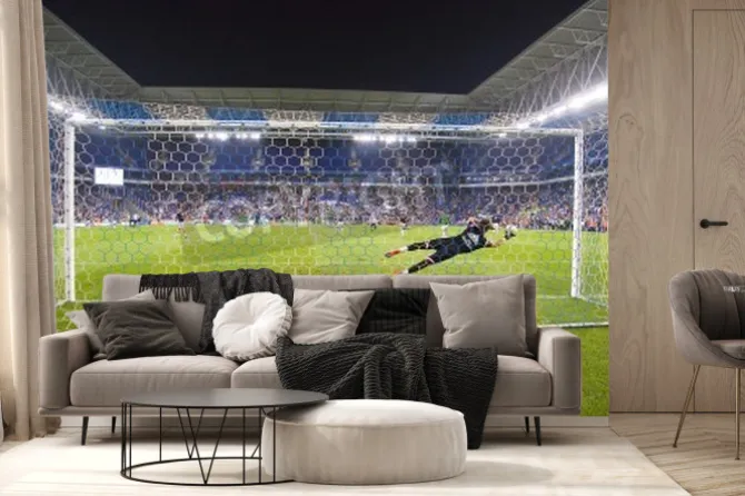 Fototapeta: Bramkarz rzucający się w obronie w stronę piłki