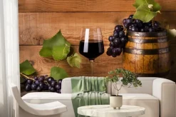 Fototapeta: Calice di vino rosso con uva e botte