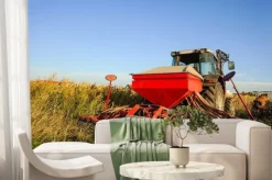 Fototapeta: Ciągnik z siewnikiem na polu