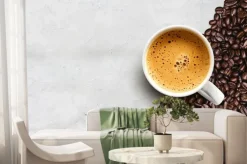 Fototapeta: Cup of coffee and bean on cement table background