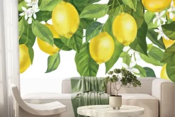 Fototapeta: Cytryny na liściastym drzewie z kwiatami