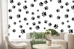 Fototapeta: Czarne łapy psów na białym tle