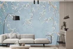 Fototapeta: Delikatne kwiaty wiśni na niebieskim tle