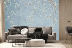 Fototapeta: Delikatne kwiaty wiśni na niebieskim tle