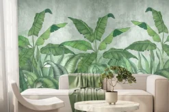 Fototapeta: Duże tropikalne liście bananowca na szarym tle