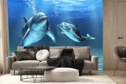 Fototapeta: Dwa delfiny pływające w błękitnej wodzie