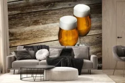 Fototapeta: Dwie szklanki do piwa na tle drewna z copyspace
