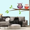 Fototapeta: Five cute colorful vector owls are sitting on a tree branch.