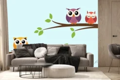Fototapeta: Five cute colorful vector owls are sitting on a tree branch.