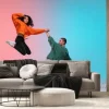Fototapeta: In jump. boy and girl dancing hip-hop in stylish clothes on colorful