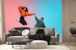 Fototapeta: In jump. boy and girl dancing hip-hop in stylish clothes on colorful