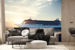 Fototapeta: Jacht na morzu na tle zachodzącego słońca