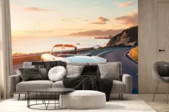 Fototapeta: Kabriolet vintage jadący nadmorską autostradą o zachodzie słońca