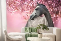 Fototapeta: Koń źrebak przy kwitnącym drzewie wiśni