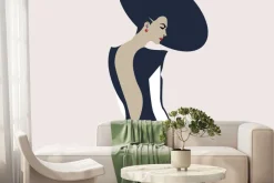 Fototapeta: Kobieta w kapeluszu na jasnym tle