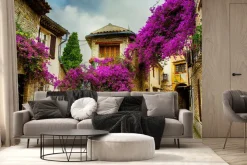 Fototapeta: Kolorowa aleja z bugenwillą w zabytkowym miasteczku