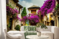 Fototapeta: Kolorowa aleja z bugenwillą w zabytkowym miasteczku