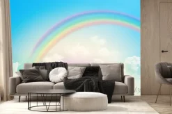 Fototapeta: Kolorowa tęcza nad chmurami na błękitnym niebie