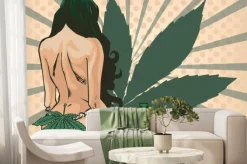 Fototapeta: Lady with cannabis leaf. the marijuana leafs on the background.