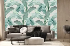 Fototapeta: Liście bananowca na betonowym tle w szarości