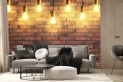 Fototapeta: Many pendant lamps against red brick wall