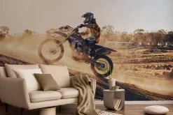 Fototapeta: Motocyklista jadący po wzgórzu