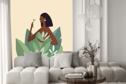 Fototapeta: Naked beautiful young woman in big leaves with dark skin and