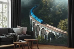 Fototapeta: Niebieski pociąg na moście krajobraz