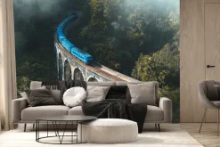 Fototapeta: Niebieski pociąg na moście krajobraz