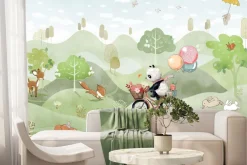 Fototapeta: Panda na rowerze na łące z lisami