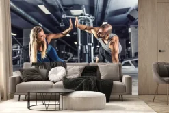 Fototapeta: Para sportowców ćwicząca na siłowni
