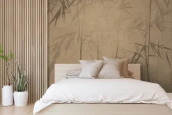 Fototapeta: Pędy bambusu na brązowej ścianie