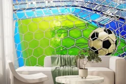 Fototapeta: Piłka nożna w siatce na tle boiska