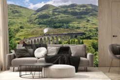 Fototapeta: Pociąg jadący po moście wśród gór