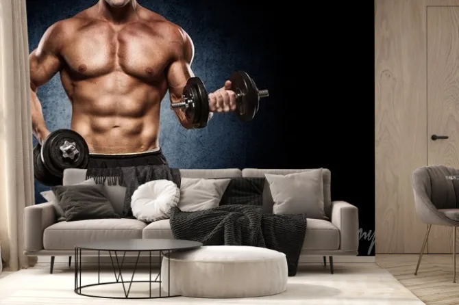 Fototapeta: Przystojny mężczyzna z dużymi mięśniami, stwarzających na aparat