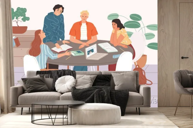 Fototapeta: Students studying together, sitting at the table and learning