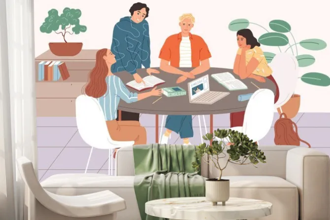 Fototapeta: Students studying together, sitting at the table and learning