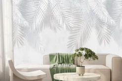 Fototapeta: Szare i białe liście tropikalne na tle betonu