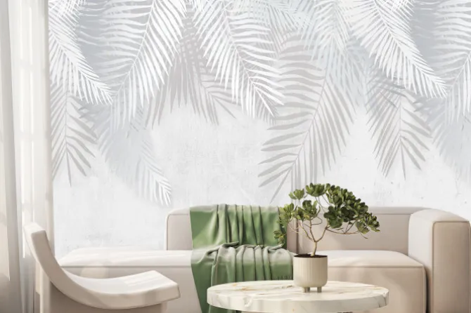 Fototapeta: Szare i białe liście tropikalne na tle betonu