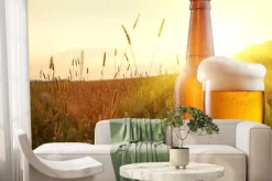 Fototapeta: Szklanka piwa i butelki z pola pszenicy i słońca