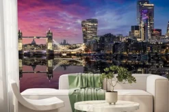 Fototapeta: The lit urban skyline with city of london and tower bridge just