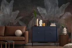 Fototapeta: Tropikalne rośliny na ciemnej betonowej ścianie