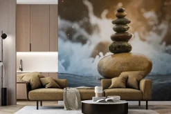 Fototapeta: Wieża z kamieni na tle wody