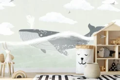 Fototapeta: Wieloryb w morzu na tle chmur i ptaków