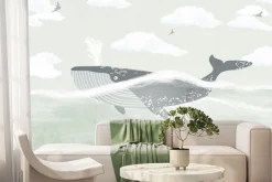 Fototapeta: Wieloryb w morzu na tle chmur i ptaków