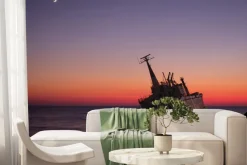 Fototapeta: Wrak statku na morzu przy zachodzie słońca